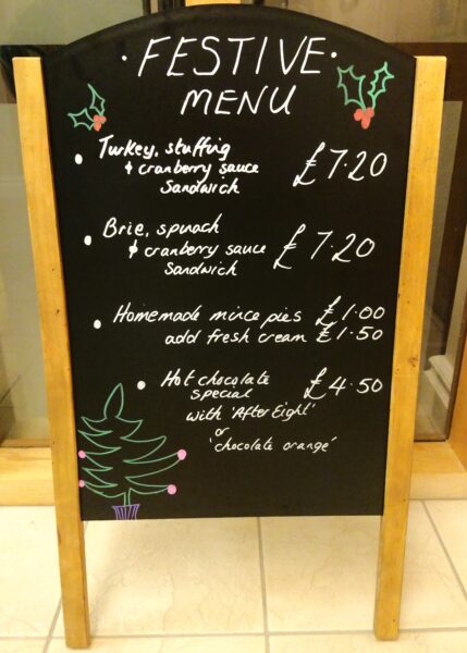 Tea room Christmas menu. Turkeystuffing and cranberry sauce sandwich, Brie spinach and cranberry sandwich, Home made mince pies, After eight or chocolate orange hot chocolate.