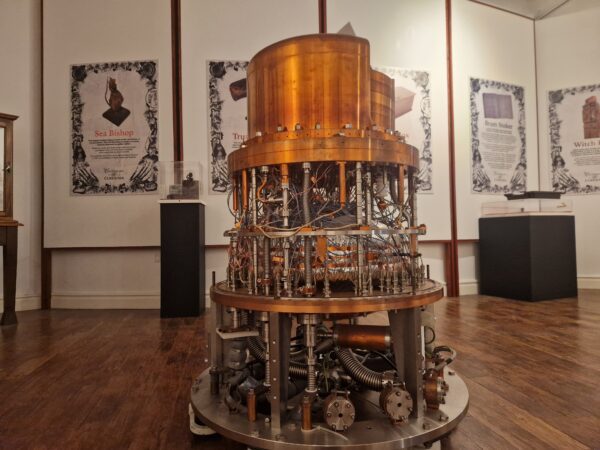 Copper machine, circular with wires and tubes entangled around the middle. It is the Zeplin III dark matter detector. 