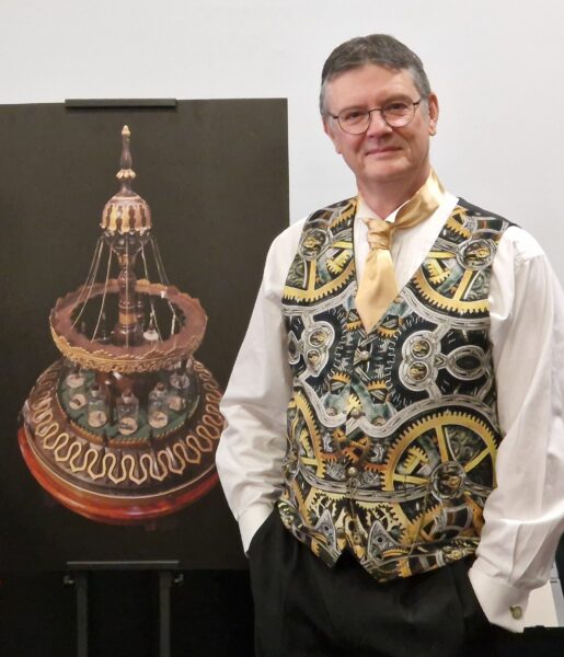 Man with short hair wearing a white shirt and a waistcoat with cogs on standing next to a board featuring an image of the Tempest Prognosticator (leech machine for predicting the weather)